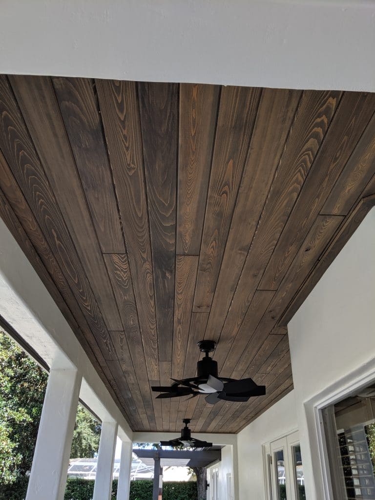A wood-stained look is a great way to change your ceiling paint color while keeping a neutral color palette.