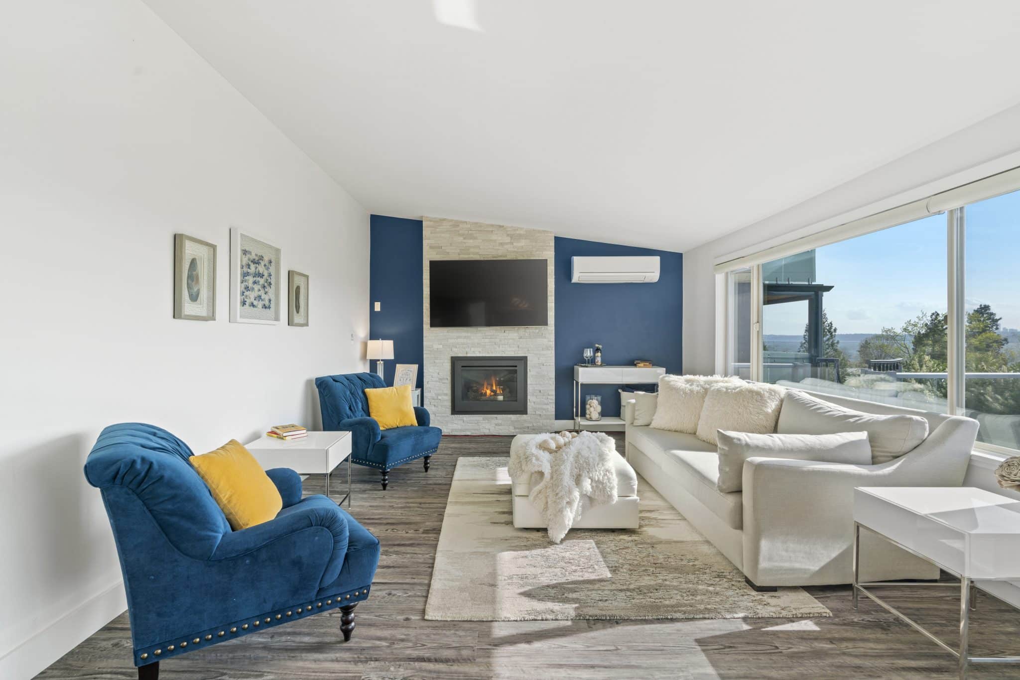 A blue accent wall makes this small living room appear larger.