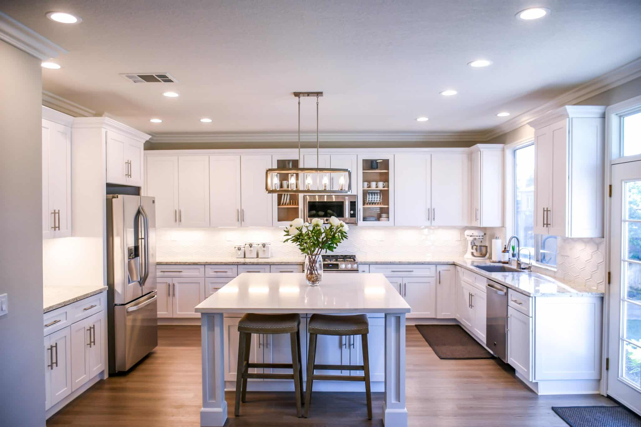 Bright white kitchen cabinets give this kitchen a bright, open, and modern look.
